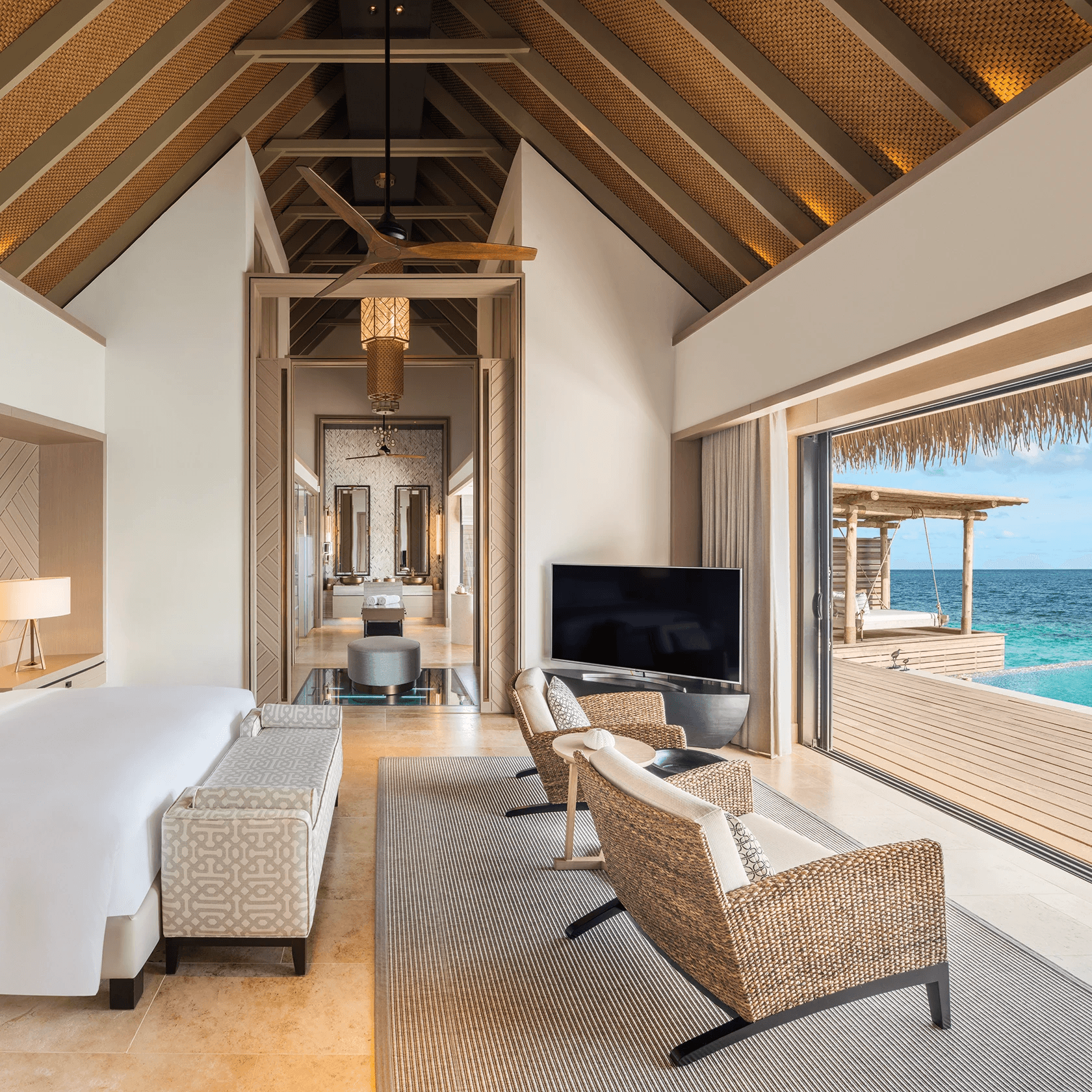 Light-filled suite opening onto a sea-view balcony