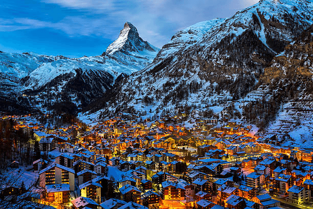 Zermatt glowing at night beneath the Matterhorn