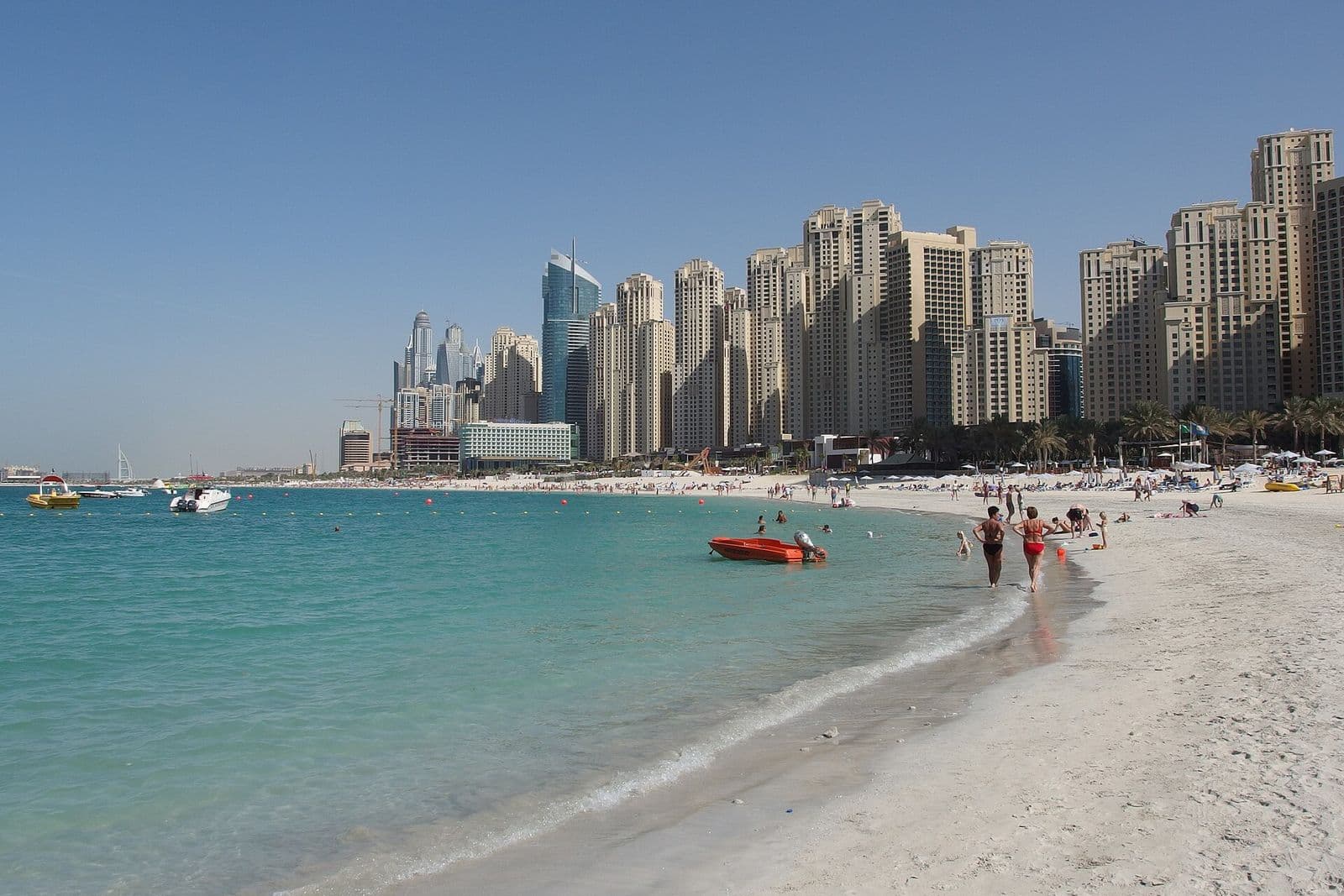 City beach with the Dubai skyline rising behind it