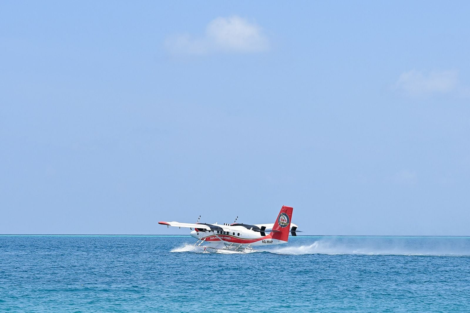 Seaplane skimming across the open sea