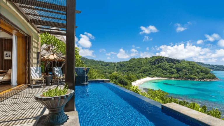 Villa infinity pool overlooking a turquoise bay
