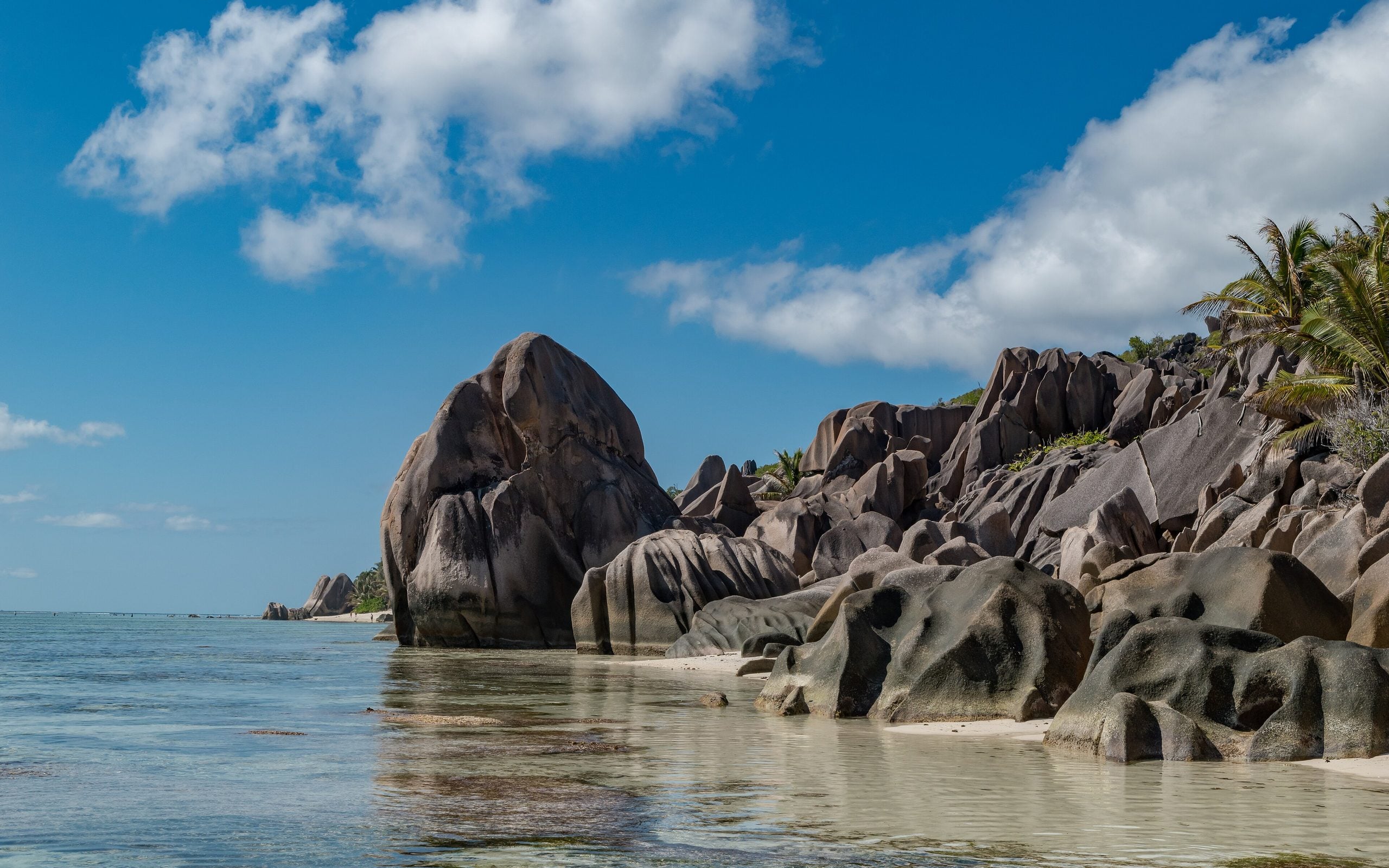 Granite boulders on a white-sand Seychelles beach