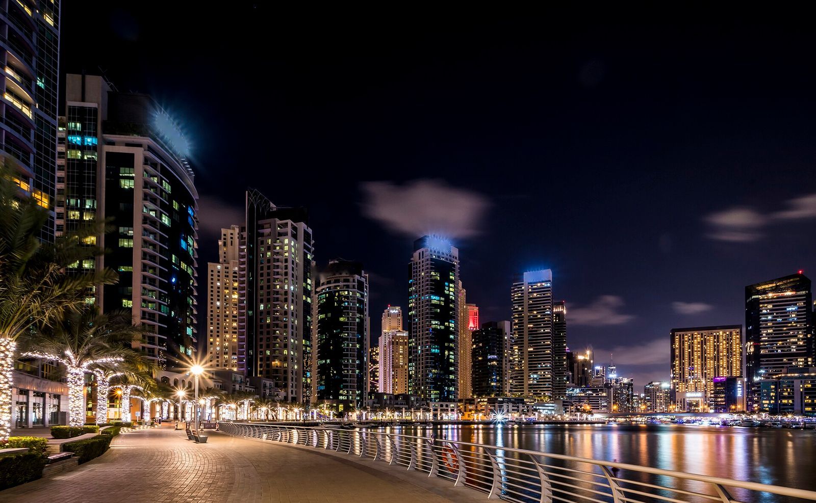 Marina promenade and towers at night