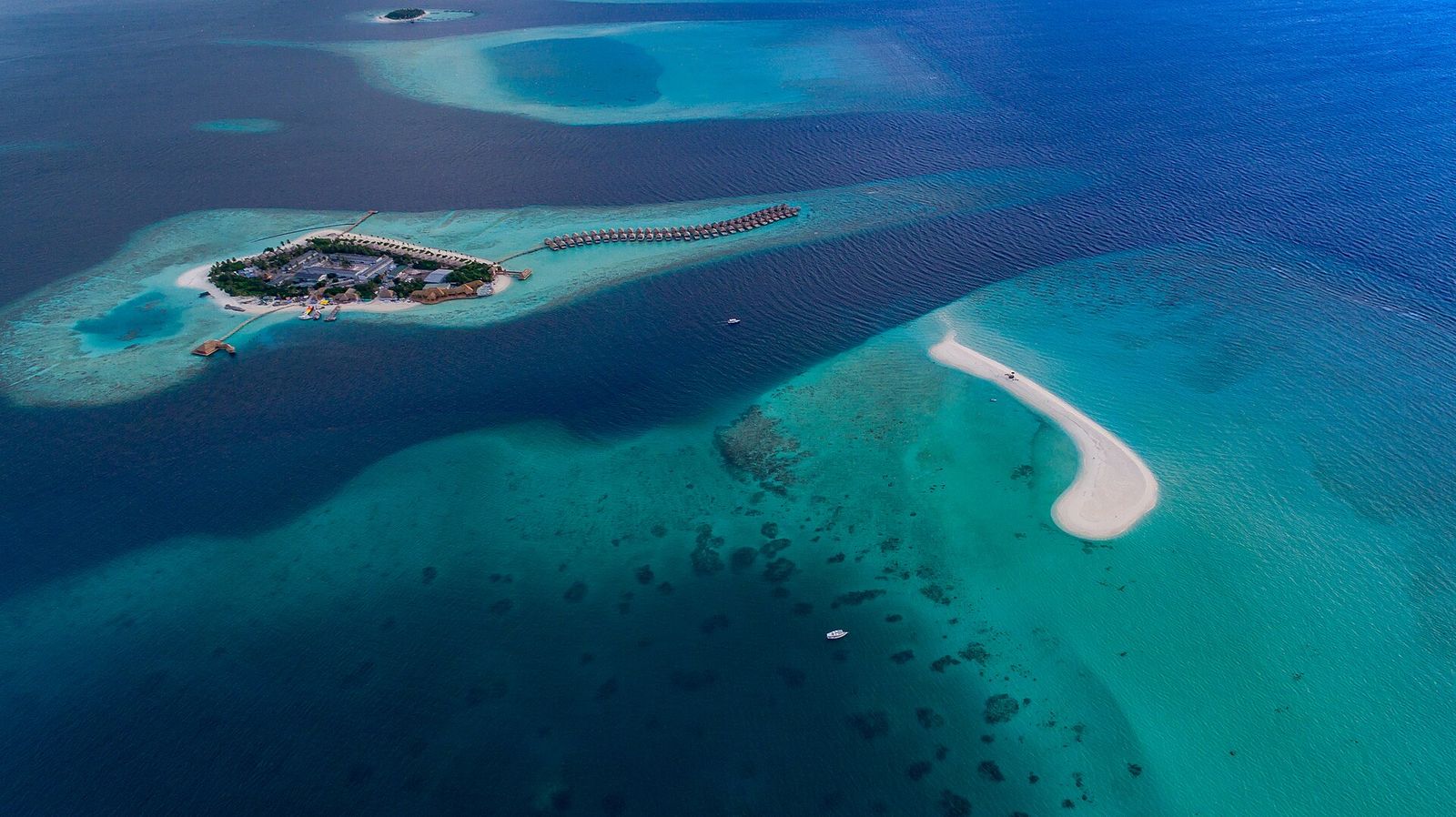 Aerial view of a small island and sandbank in the deep blue Indian Ocean