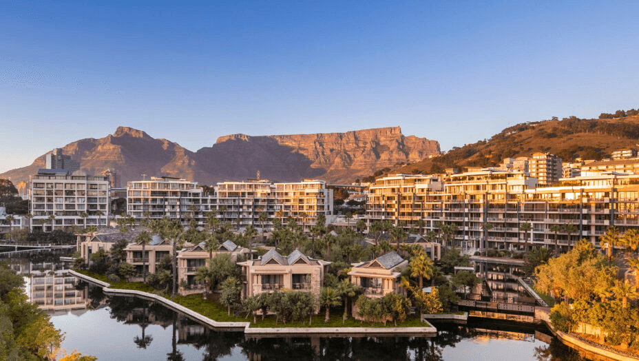Hotel villas beside a waterway below Table Mountain