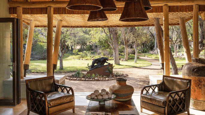 Open-sided safari lounge with leather armchairs