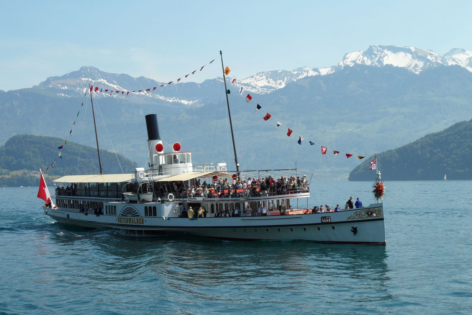 Historic paddle steamer cruising on Lake Lucerne below snowy peaks