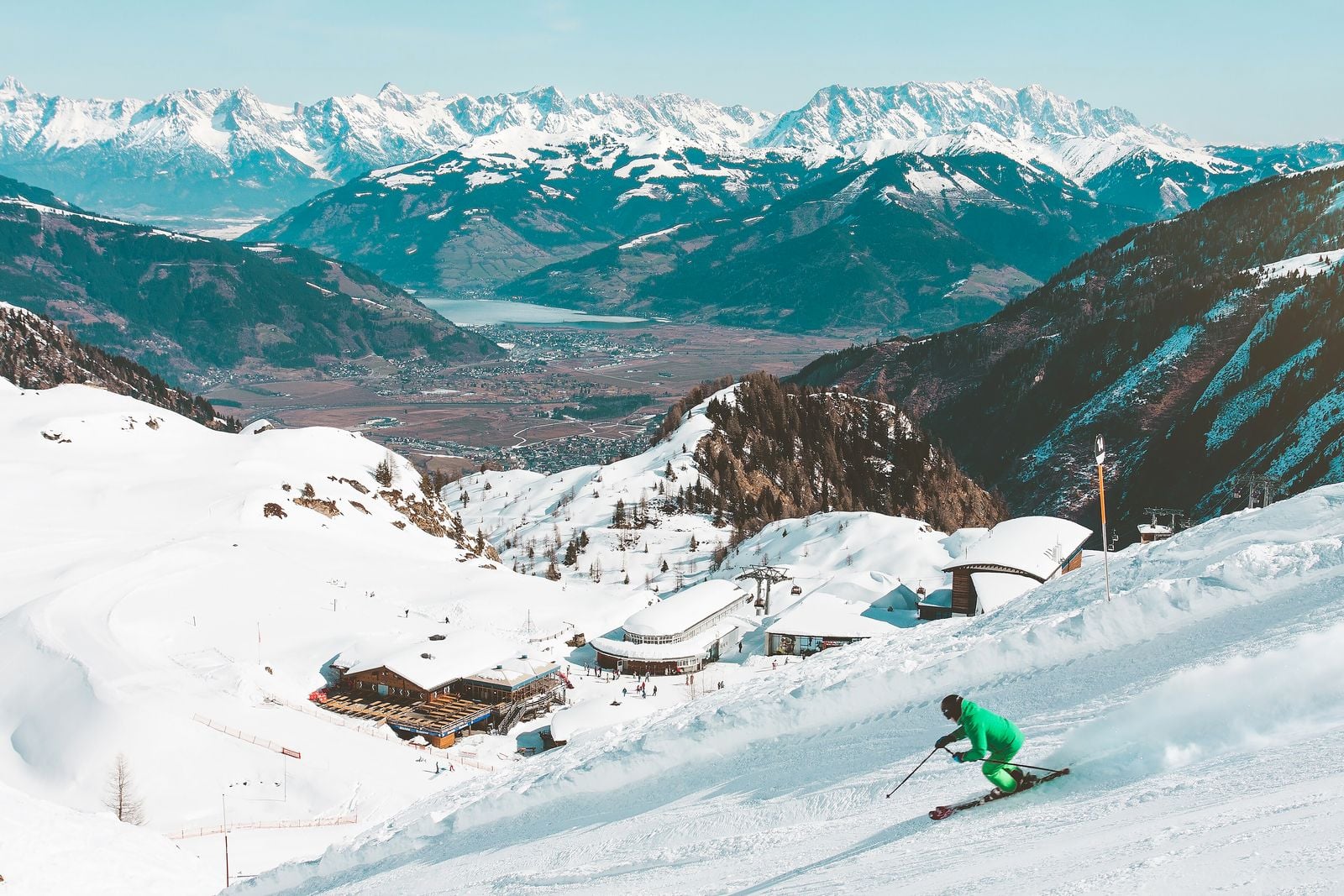 Skier carving down a freshly groomed piste