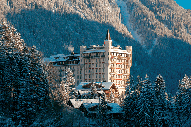Castle-like hotel in a snowy pine forest