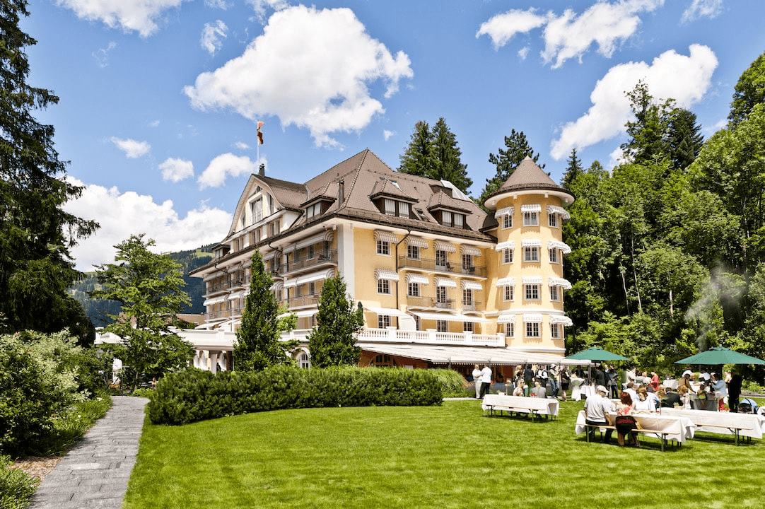 Grand hotel with a garden terrace on a sunny day