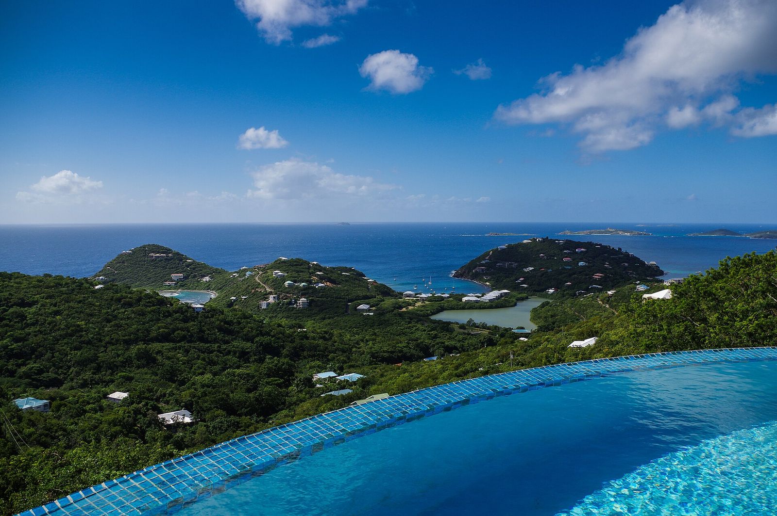 Infinity pool overlooking a tropical sea
