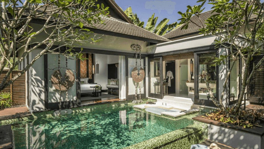 Pool villa courtyard surrounded by tropical plants