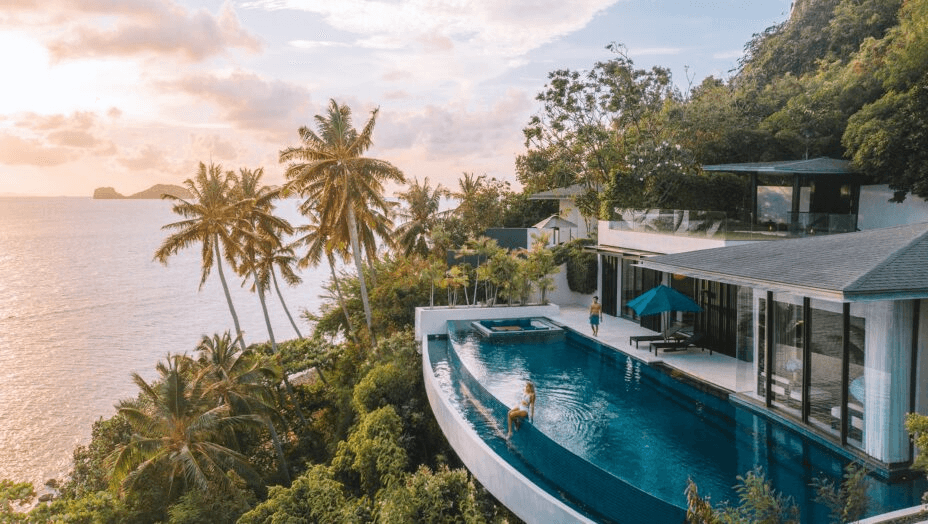 Cliffside villa infinity pool above the sea at sunset