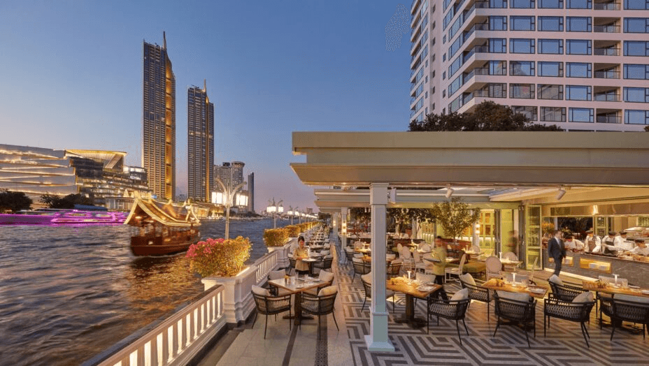 Riverside terrace restaurant at dusk