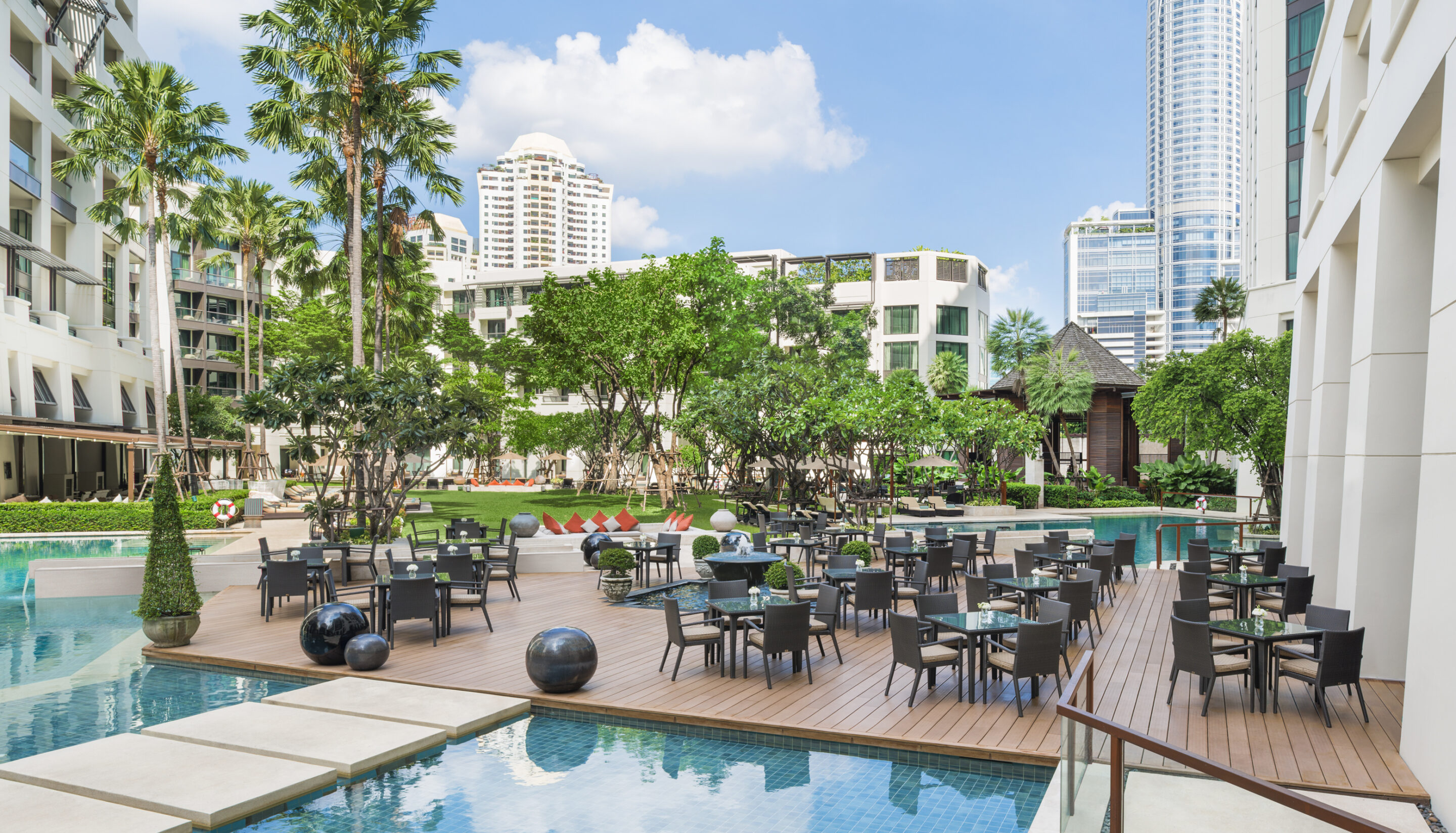 Pool terrace with outdoor dining in a city garden