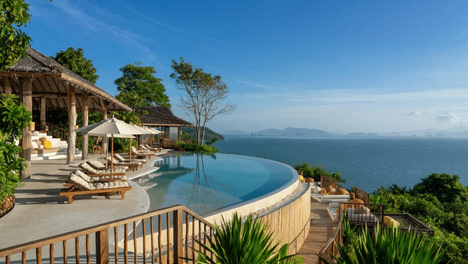 Curved infinity pool deck above a bay of islands