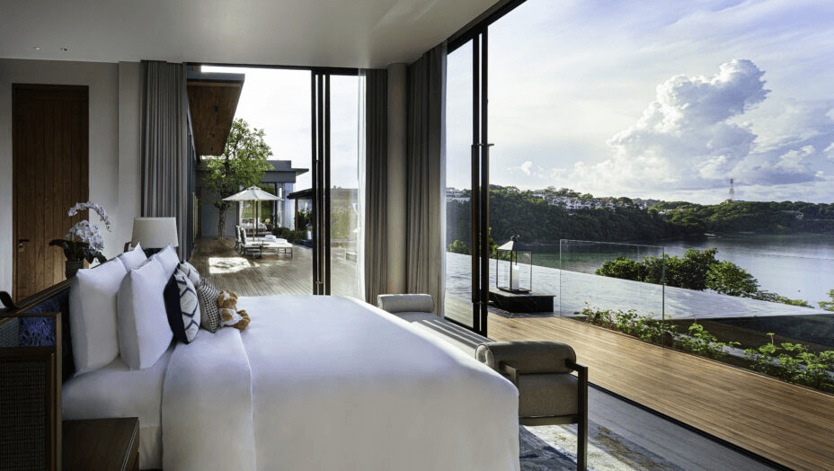 Bedroom opening onto a terrace above the sea