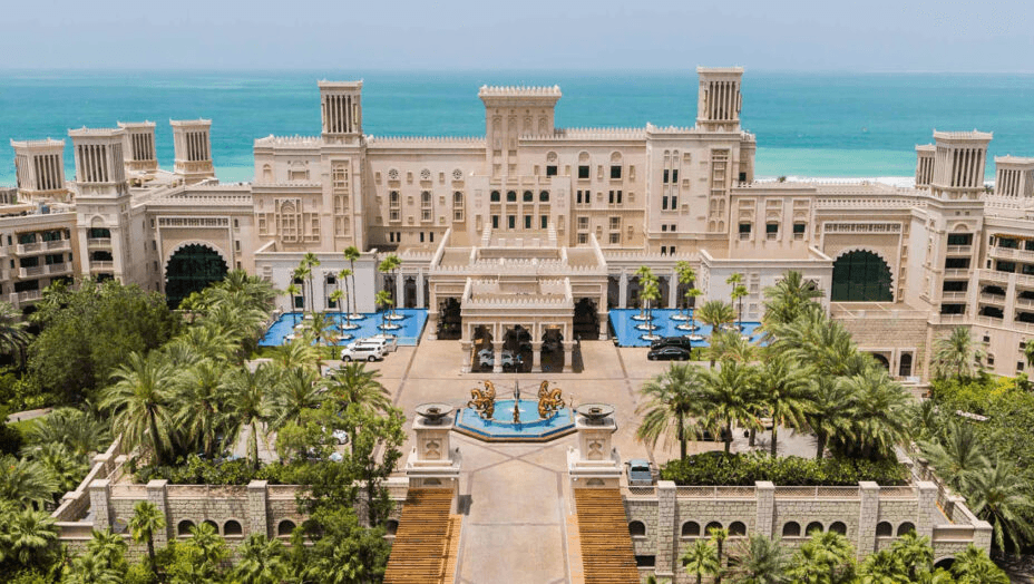 Palace-style hotel façade above a fountain courtyard