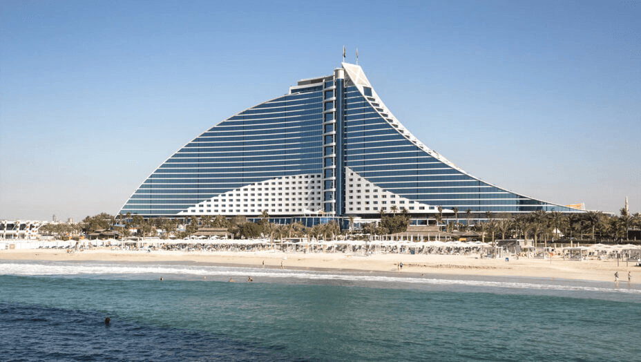 The wave-shaped Jumeirah Beach Hotel above its beach