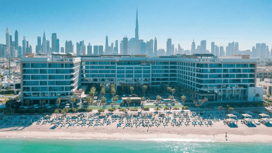 Beachfront hotel with the Dubai skyline behind