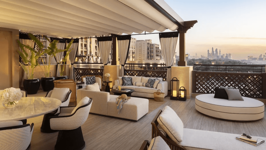 Shaded terrace lounge looking towards the Dubai skyline