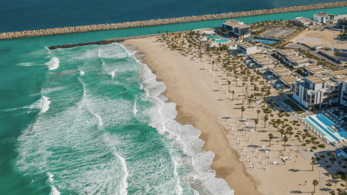 Long sandy beach and resort seen from the air